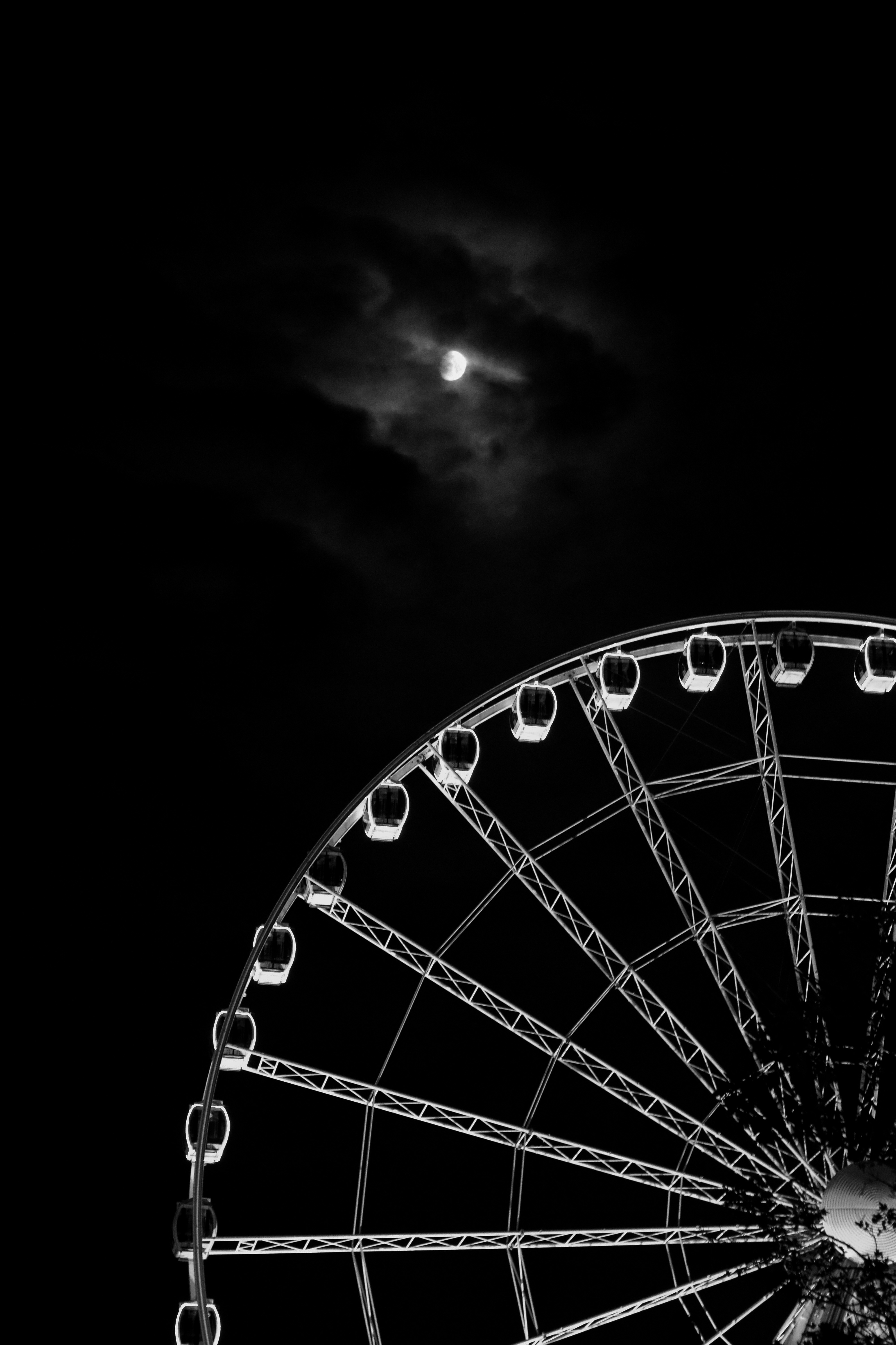 Moon above a Ferris wheel